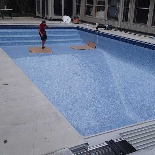 Pool liner being added to backyard pool Pool liner being added to backyard pool